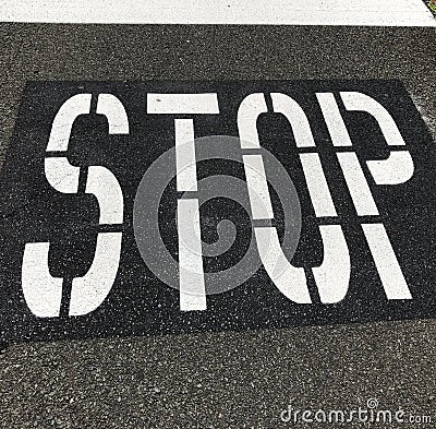 Sign on the road `STOP` Stock Photo