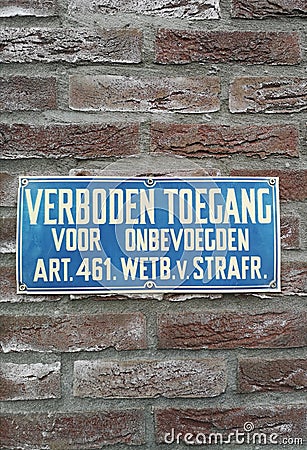 Sign saying in Dutch that access is not allowed for unauthorized people Stock Photo