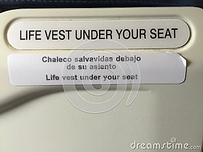 Sign saying life vest under your seat Stock Photo