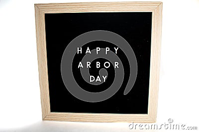 A Sign That Says Happy Arbor Day On a White Background Stock Photo