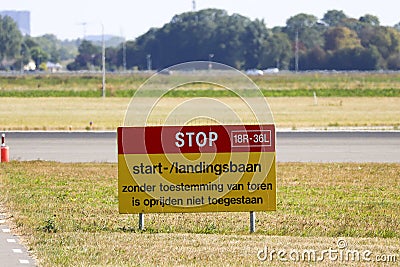 Sign at Schiphol Amsterdam Airport with Stop - Start and landin strip in dutch language Stock Photo