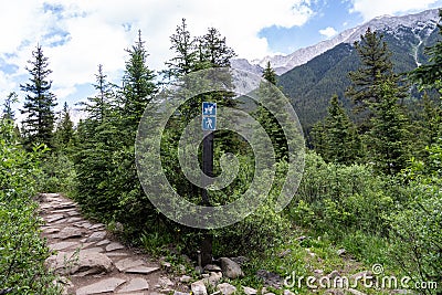 Sign seperating directions on the trail for hikers and horseback riders. Taken on the Ink Pots trail in Johnston Canyon - Banff Stock Photo