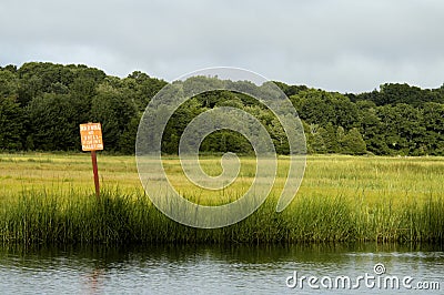 Sign in shellfish bed Stock Photo