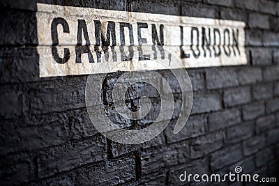 Camden, London, white text on a black brickwall Stock Photo