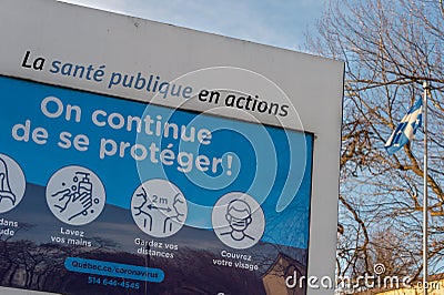 Sign showing Covid-19 safety guidelines in Montreal Editorial Stock Photo