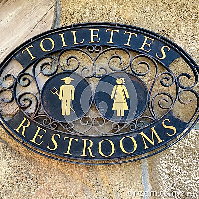 A sign signifying a restroom entrance Stock Photo