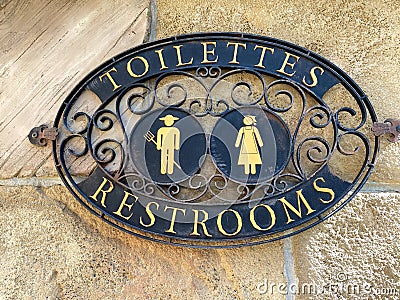 A sign signifying a restroom entrance Stock Photo