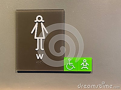 A sign signifying a womens bathroom or lavatory entrance Stock Photo