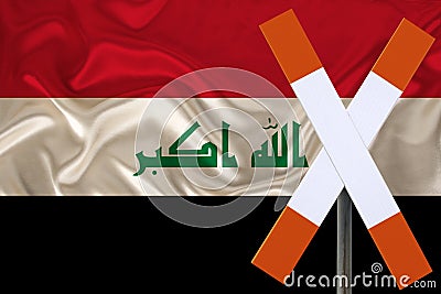 Sign, stop, attention against the background of the silk national flag of Iraq, the concept of border and customs control, Stock Photo