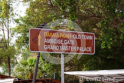 Sign to Rhodes old town through the Amboise Gate and to the Grand Master Palace Editorial Stock Photo