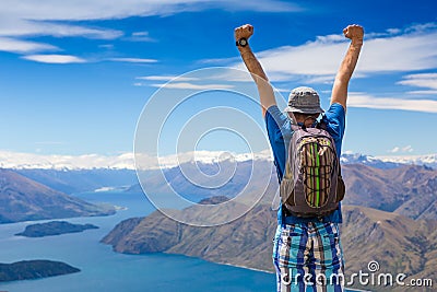 Sign of victory: hiker on the top Stock Photo