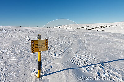 A sign warning of the avalanche area, white elbe valley, krkonose mountains, winter day Stock Photo