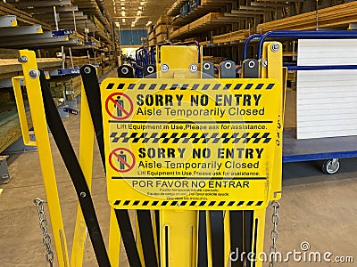 A sign warning customers to stay out of an area that says sorry no entry aisle temporarily closed at a Lowes home improvement Editorial Stock Photo