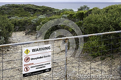 Sign 'Warning Unexploded Bombs' in Point Nepean National Park in Australia Editorial Stock Photo