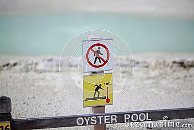 Sign warning on walkway Stock Photo