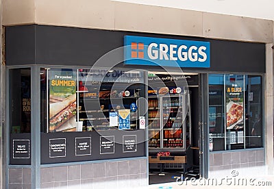 Sign and window display on the greggs bakers shop on bond street in leeds city centre Editorial Stock Photo
