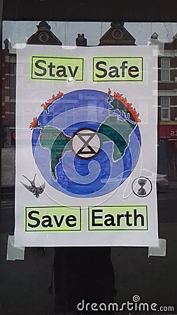 Sign in window stay safe save the world Sydenham south east london Editorial Stock Photo