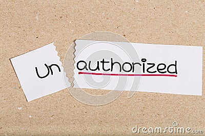 Sign with word unauthorized turned into authorized Stock Photo