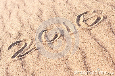 Sign 2016 written on sandy beach. Summer travel concept Stock Photo