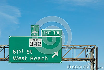 signage at highway at Galveston with exit west beach and direction scholes airport in Galveston, Texas Stock Photo