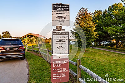 Signage instructing patrons about fishing policy at a lake Stock Photo