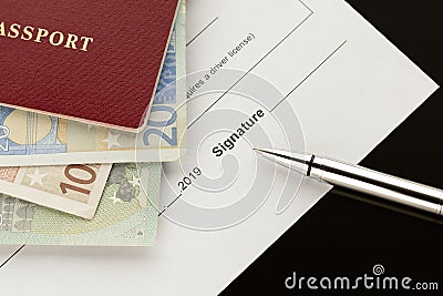 Signature, signing a document. Passport with euro banknotes Stock Photo