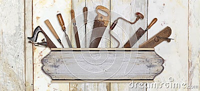 Signboard and carpenter tools on wooden background Stock Photo