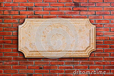 A signboard marble on brick wall. Stock Photo
