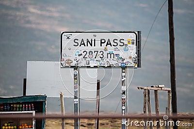 Signboard "Sani Pass 2873m" in the street on the border between Lesotho and South Africa Editorial Stock Photo