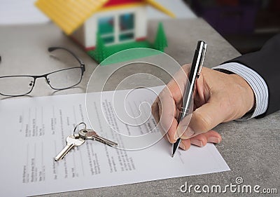 Signed house purchase agreement after the loan approval. Stock Photo