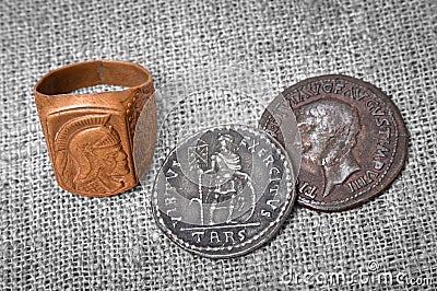 Signet ring and two coins of the ancient Roman Empire Stock Photo