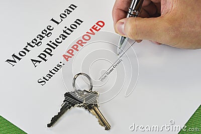 Signing An Approved Real Estate Mortgage Loan Stock Photo