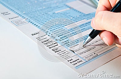 Signing a financial paper. Stock Photo