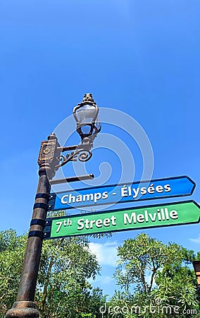 signpost with classic lights under blue sky Stock Photo