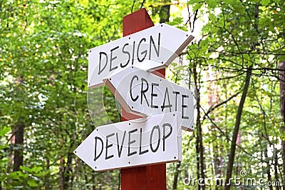 Design, create, develop - signpost with three arrows Stock Photo