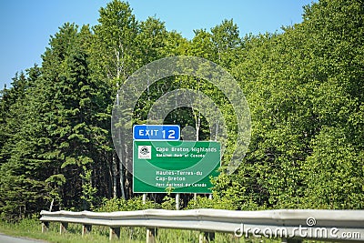 Signposts for Cape Breton Highlands Parks Canada along the Trans Canada Highway NS105, Exit 12 Editorial Stock Photo