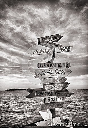 Signposts with cities from all over the world at Mallory Square in Key West Stock Photo