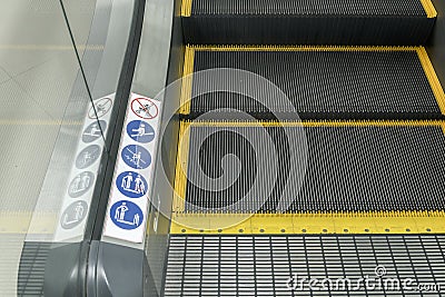 Signs on an escalator, warning signs Stock Photo