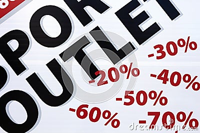 Signs on shop window indicate sale and discount percentages Stock Photo