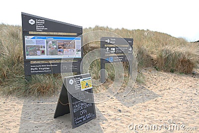 Signs and visitor information at Ynyslas sand dunes Editorial Stock Photo