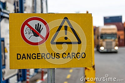 Signs warn of job security. Sign `dangerous cargo`. Stock Photo