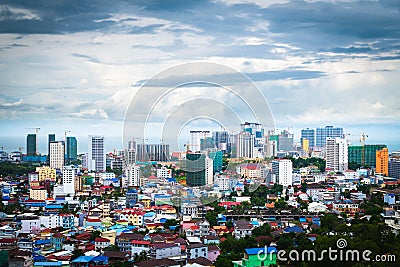 Sihanoukville, Cambodia- July 06, 2020: High angle view of city and high rise building under construction. Fast growing economy fr Editorial Stock Photo