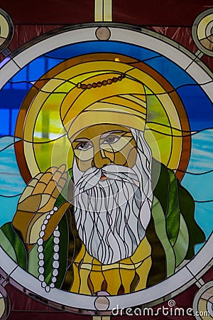 Sikh guru portrait on stained glass in the Sikh temple Stock Photo