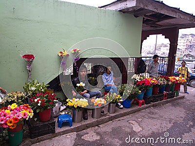 Sikkim Local people selling flowers in the market, Gangtok City,Sikkim INDIA , 16th APRIL 2013 Editorial Stock Photo