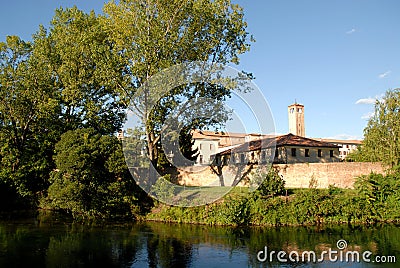 Sile river bank, with trees and buildings, in Treviso in the Veneto (Italy) Stock Photo