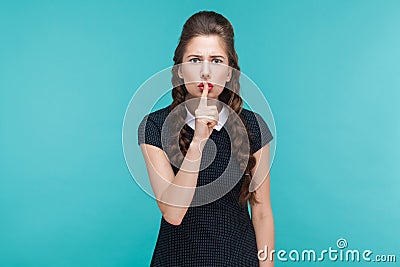 Silence, quiet, secret concept. Expressive young woman showing s Stock Photo