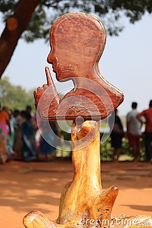 Silence symbol carved out of wood inside Auroville in Puducherry, India Editorial Stock Photo