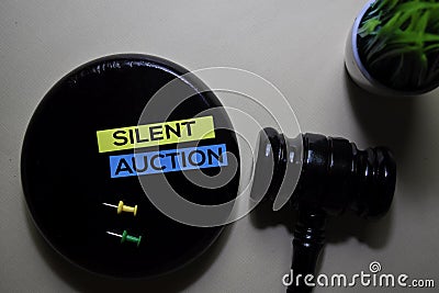 Silent Auction text on sticky notes and gavel isolated on office desk. Justice law concept Stock Photo