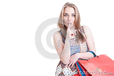 Silent concept with stylish beautiful woman doing shush gesture Stock Photo