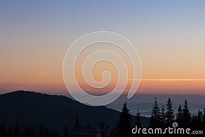 Silent morning in Carpathian montains. Forest silhouettes in mountains at dawn with copy space. Vasness and peace concept. Stock Photo